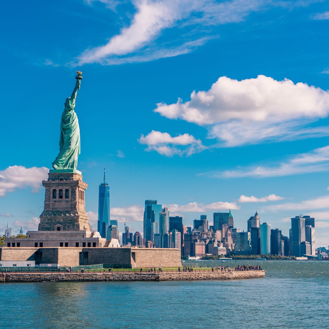 Statue of Liberty with Lower Manhattan skyline, a leading private jet charter destination from Europe.